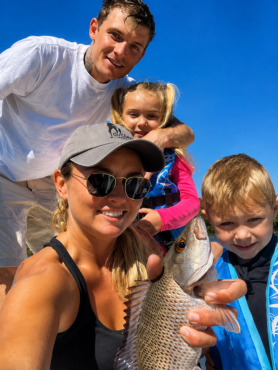 A family selfie with a mangrove snapper